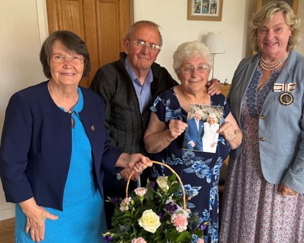 Midlothian Councillor Ellen Scott, on the left, and Depute Lord Lieutenant Harriet Dalrymple visited Wallace and Susan Clark at their home.