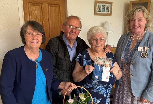 Midlothian Councillor Ellen Scott, on the left, and Depute Lord Lieutenant Harriet Dalrymple visited Wallace and Susan Clark at their home.