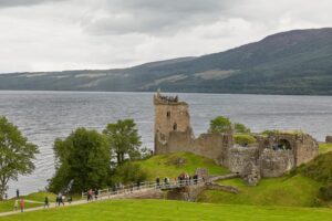 78050440 people enjoying vist at urquhart castle on the shore of loch ness scotland