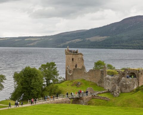78050440 people enjoying vist at urquhart castle on the shore of loch ness scotland