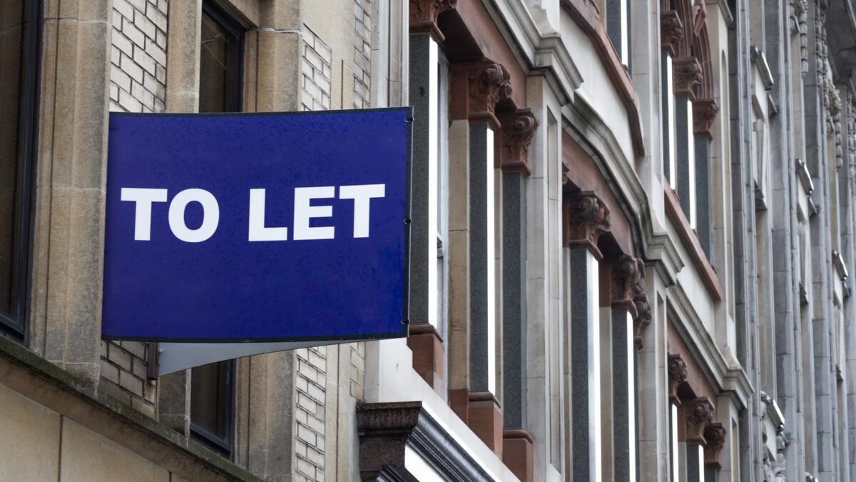 104176830 blue to let sign on a classic building facade