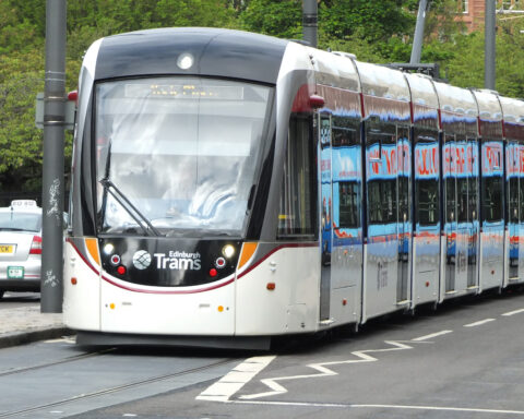 Caption: An Edinburgh tram on Princes Street. The city is considering the next major expansion of the network, with proposed routes towards Granton in the north and the Royal