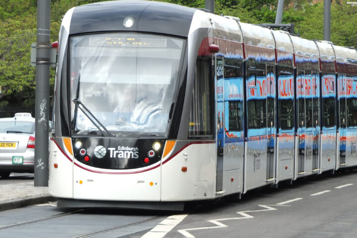 Caption: An Edinburgh tram on Princes Street. The city is considering the next major expansion of the network, with proposed routes towards Granton in the north and the Royal