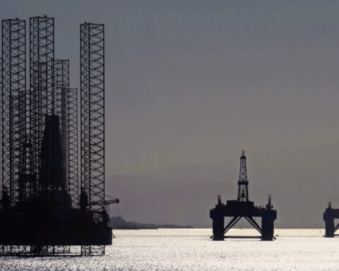 North Sea oil platforms stand waiting in the Cromarty Firth near Invergordon, Scotland