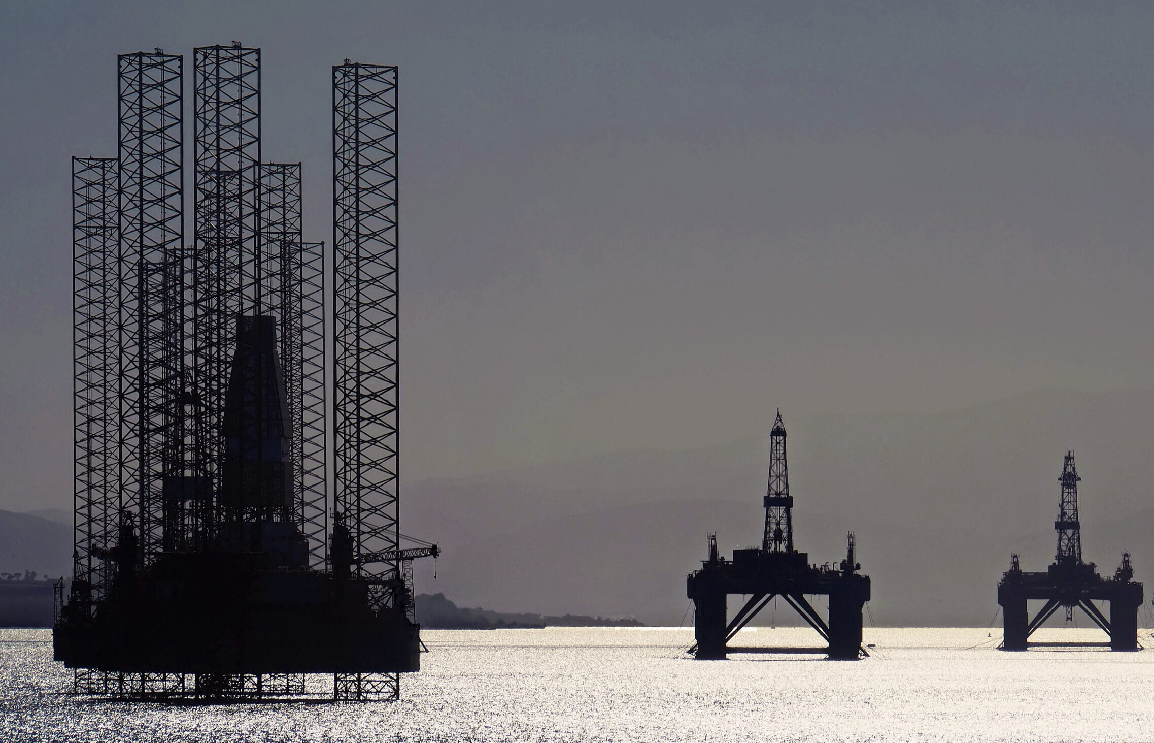 North Sea oil platforms stand waiting in the Cromarty Firth near Invergordon, Scotland