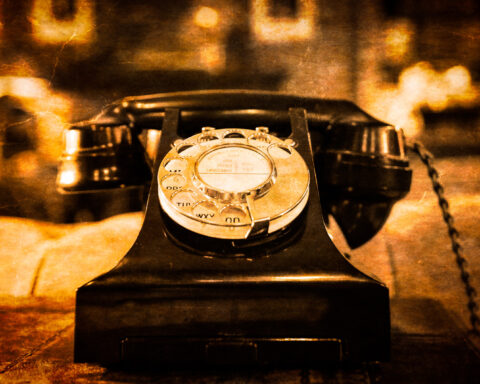 10136160 detail view of old vintage dial telephone on the table