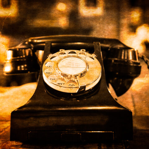 10136160 detail view of old vintage dial telephone on the table