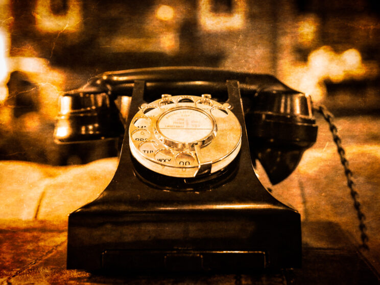 10136160 detail view of old vintage dial telephone on the table